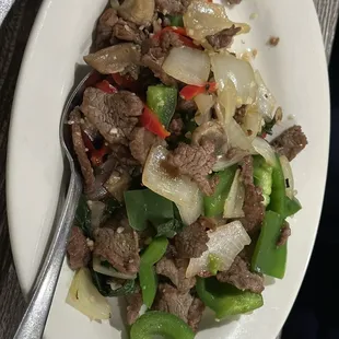 Thai pepper steak with sauce on the side.