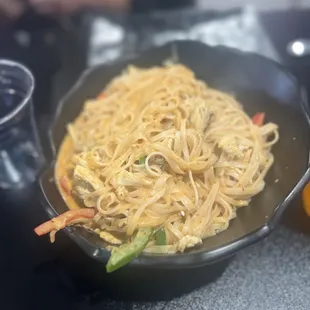 a plate of noodles and vegetables