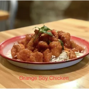 a plate of orange soy chicken