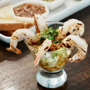 a shrimp cocktail and grilled bread