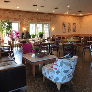 a dining room with tables and chairs