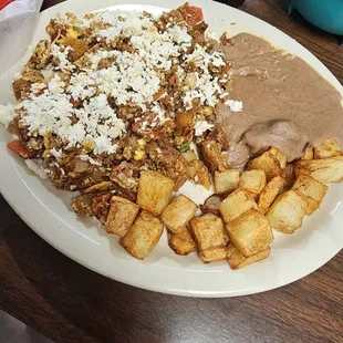 #50 chilaquiles a la Tias ,  chorizo with egg and tortilla chips