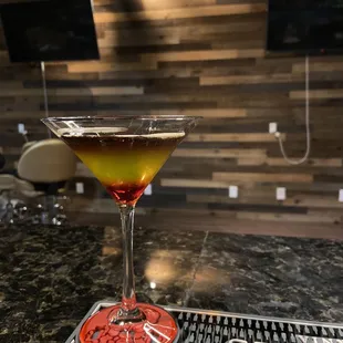 a cocktail in a martini glass