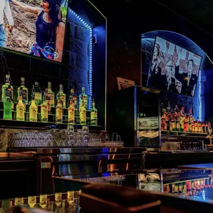 a bar with many bottles of alcohol