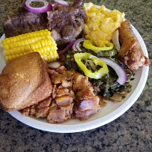 The hungry Jack Plate. OX tails, fried Chick  yams, corn on the cobb, Mac and cheese,Collard Greens and a corn bread muffin