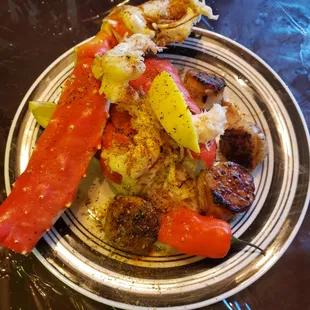Crab legs, Lobster, Shrimp and Scallops over a bed of rice