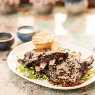 8 hours slow cooked oven braised lamb riblets with lemon oregano