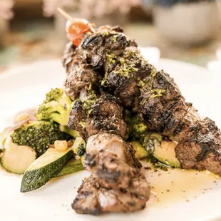 Mykonos Souvlaki-herbs marinated prime tenderloin,shallots &amp;rosemary skewers with seasonal veggie