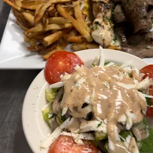 Combination gyro meat with chicken souvlaki  and Greek salad