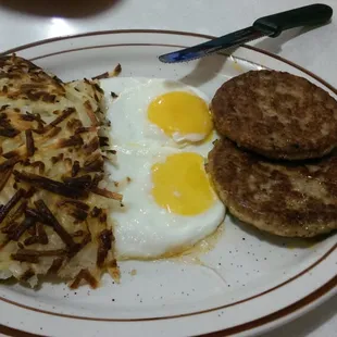 Pathetic looking eggs, dry looking sausage and over cooked hash browns.