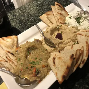 a plate of pita chips and hummus