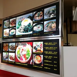 Myong Dong Boon Shik's menu board with pictures.