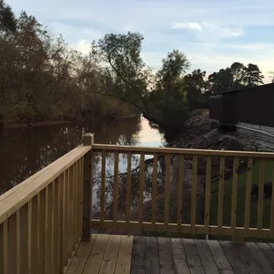 a wooden deck overlooking a river