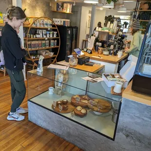 a woman standing in front of the counter