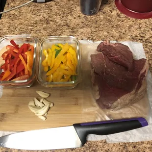 meat, vegetables, and a knife