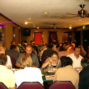 a group of people sitting at a table