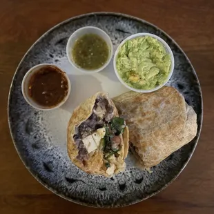 Tofu Verde Burrito with guacamole and chip sauces