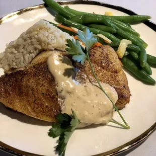 Bronzed Chilean Sea Bass - lightly blackened served with our hijiki soy ginger sauce. Comes with choice of rice or potatoes and veggie