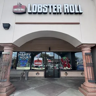 Connecticut Lobster Roll with a side of slaw and pickle spear.