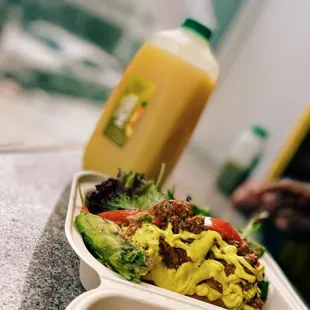 a salad in a styrofoam container