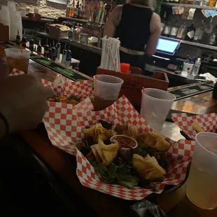 a tray of food on a bar counter