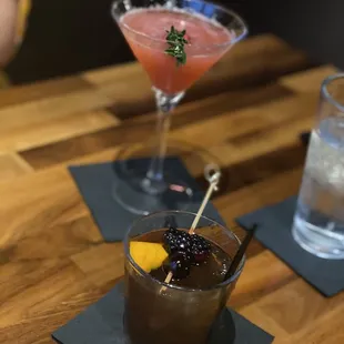 two cocktails on a table