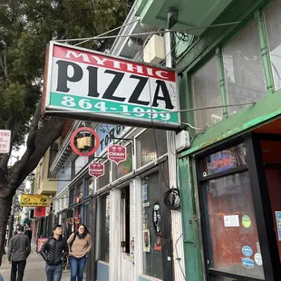 people walking down the sidewalk