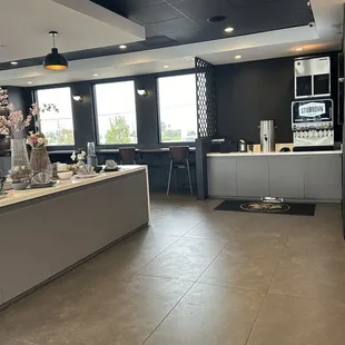 Entryway with self serve drinks and display table