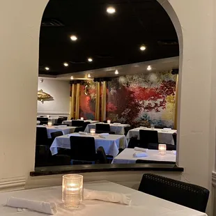 a dining room with tables and chairs