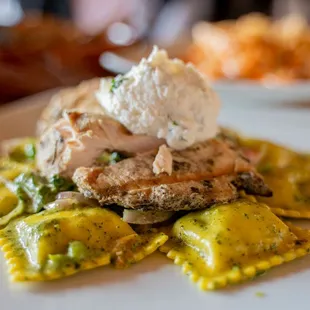 Chicken  spinach ravioli. Note adding chicken adds an extra 5 dollar