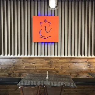 two wooden chairs and a table