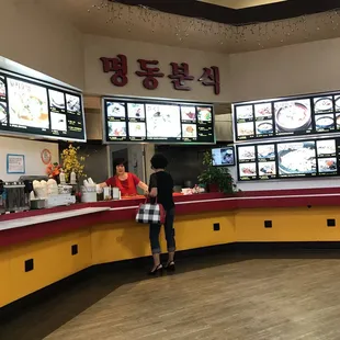 a woman standing at the counter