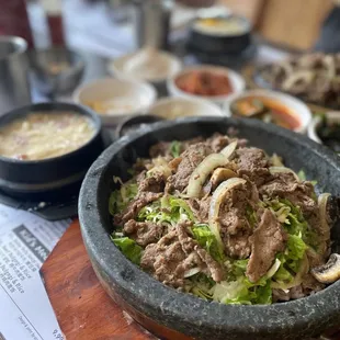 a bowl of beef and lettuce