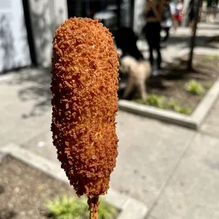 a hot dog on a stick