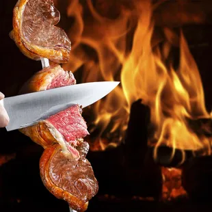 a hand holding a knife