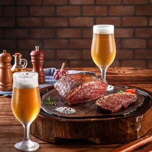 a steak and a glass of beer