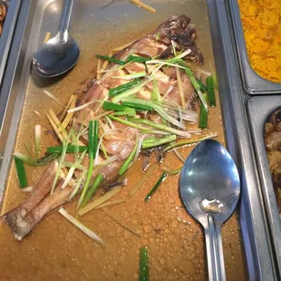 a whole fish in a pan