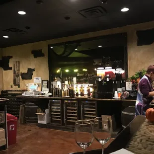 a man and a woman preparing food in a restaurant