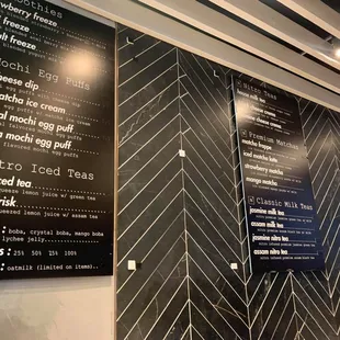 The menus on the wall. There's another menu on the glass near the cashier with more options!