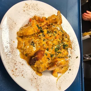Shrimp and Grits 
Grit cakes topped with NaBogue&apos;s signature sauce and Shrimp