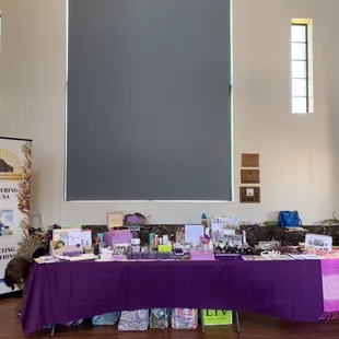 This table has assorted cosmetics, fragrances and locally made accessories