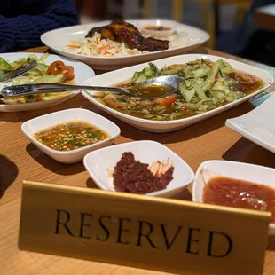 Cucumber salad with a variety of sauces.