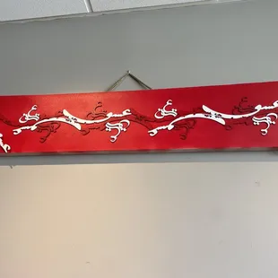 a red sign with a dragon on it