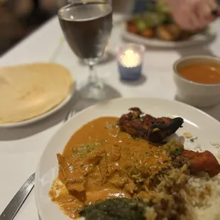 An assortment from their buffet. Fish, chicken tandoori, butter chicken, rice, Sag Paneer. Tomato soup!