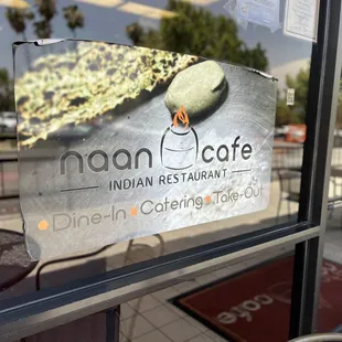 a sign in the window of a restaurant