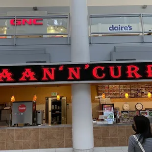 a woman standing in front of a restaurant