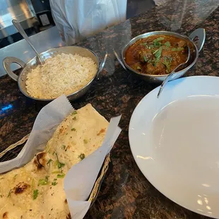 Goat Masala with Bone, rice and garlic naan