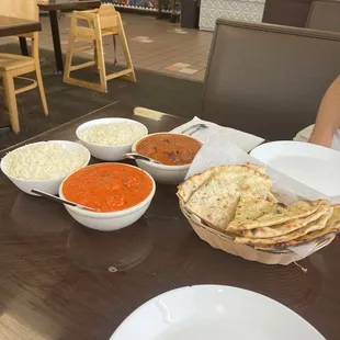 Butter chicken, chicken vindaloo, garlic naan, Cheese Naan