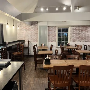 a dining room with tables and chairs