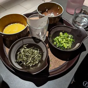 a variety of bowls of food on a table